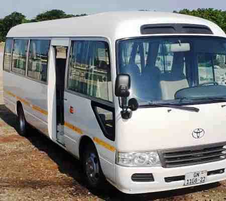rent air-conditioned 29-seater toyota coaster bus accra ghana affordable